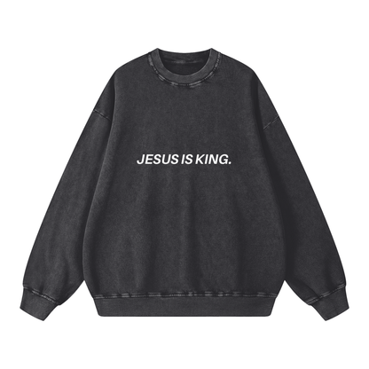 Black sweatshirt with 'JESUS IS KING.' text on a white background