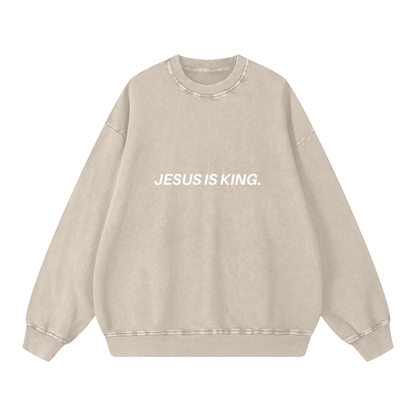 Beige sweatshirt with 'JESUS IS KING' text on a white background