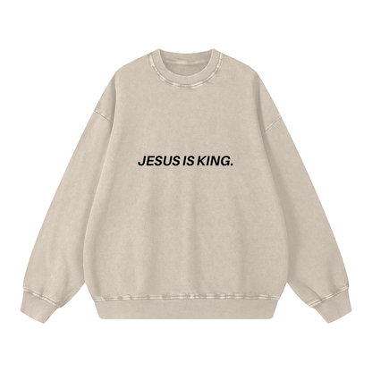 Beige sweatshirt with 'JESUS IS KING.' text on a white background