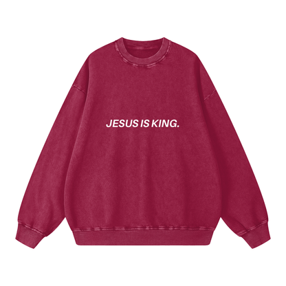 Red sweatshirt with 'JESUS IS KING.' text on a white background