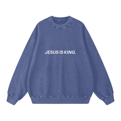 Blue sweatshirt with 'JESUS IS KING.' text on a white background