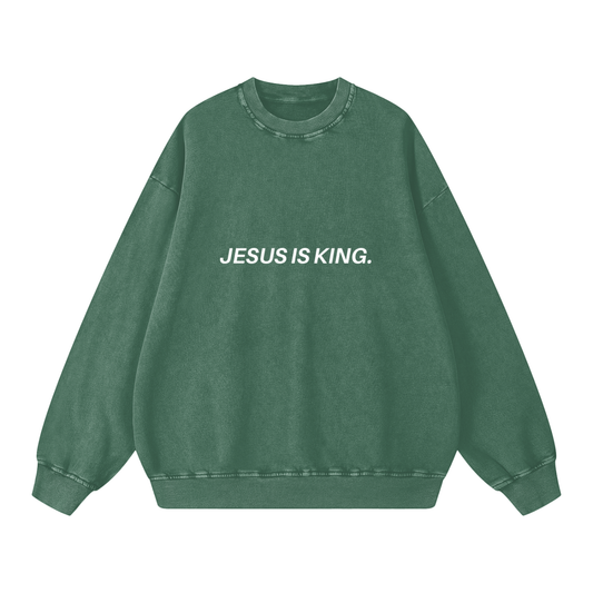 Green sweatshirt with 'JESUS IS KING.' text on a white background